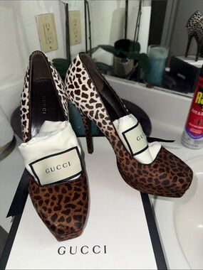 Gucci Leopard Print Pony Hair Platform Pumps.
